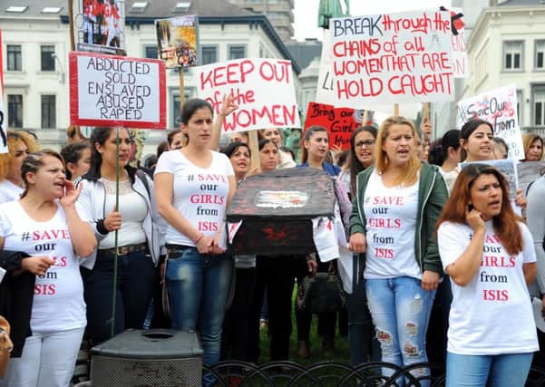 Yazidi women call for the release of IS captives outside the European Parliament in Brussels. Picture: Getty