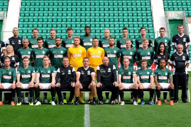 Hibs players and management pose for their official photcall yesterday. Manager Alan Stubbs, front row centre, made it clear that results must improve fast. Picture: Lisa Ferguson