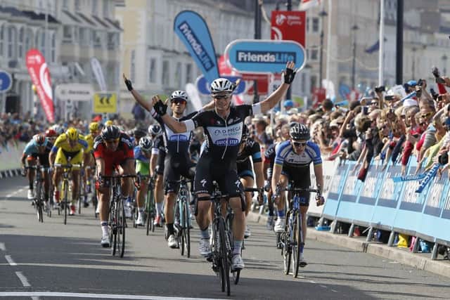 Australian Mark Renshaw starts to celebrate as he crosses the line to win the second stage. Picture: PA