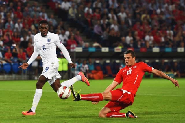 Two-goal striker Danny Welbeck is poised to slam home Englands opening goal against Switzerland last night. Picture: Getty