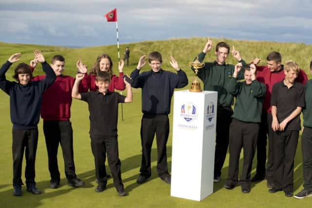 School children pose with the world famous trophy. Picture: Contributed