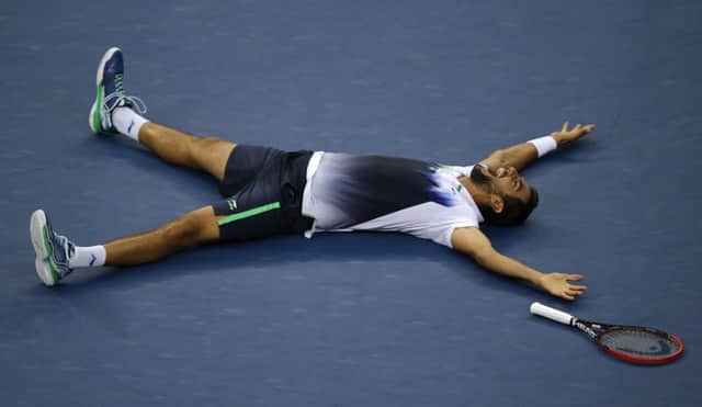 Marin Cilic lies flat out on Arthur Ashe court after beating Japans Kei Nishikori in the US Open. Picture: Getty