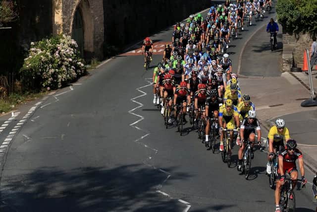 The peloton rides through the town of Crickhowell in Wales during stage three of the Tour of Britain. Picture: PA