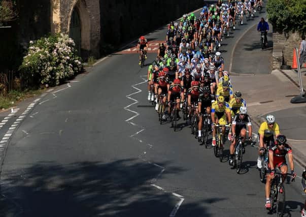 The peloton rides through the town of Crickhowell in Wales during stage three of the Tour of Britain. Picture: PA