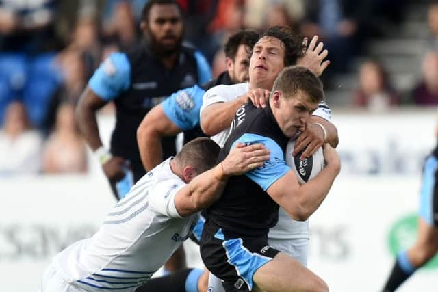 Cian Healy, left, and Mike McCarthy get to grips with Glasgows Mark Bennett. Picture: SNS