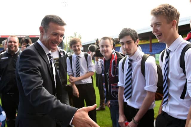 Jim McIntyre is all smiles after being announced as manager of Ross County. Picture: SNS