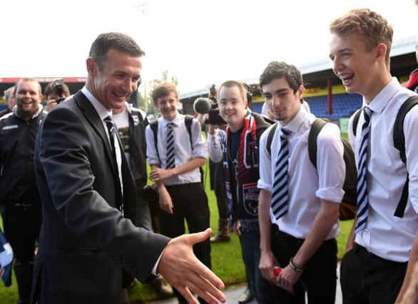 Jim McIntyre is all smiles after being announced as manager of Ross County. Picture: SNS