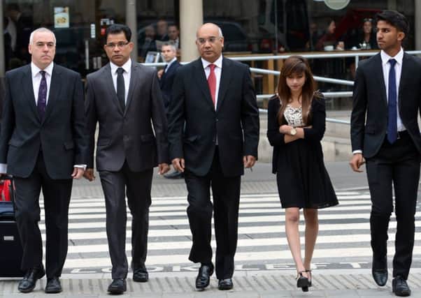 Benedict Barboza (2nd L), the husband of late nurse Jacintha Saldanha, their children Lisha  and Junal Barboza (R)  arrive at the High Court in London. Picture: Getty