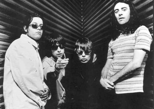 Robert Young (right) pictured with his  Primal Scream bandmates in 1997. Picture: Contributed