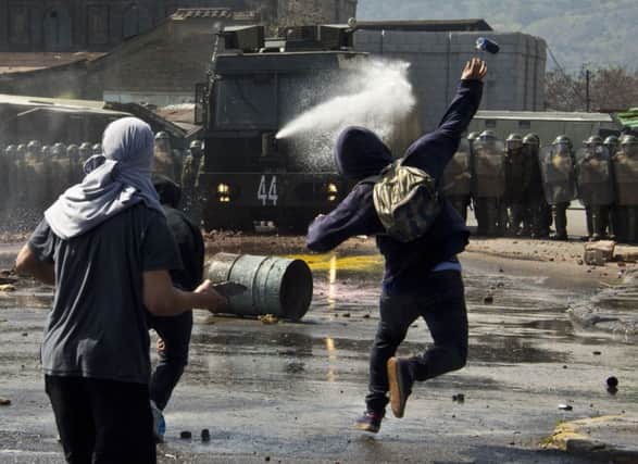 Chilean protesters clash with police on the anniversary of the coup that ousted Allende. Picture: Getty