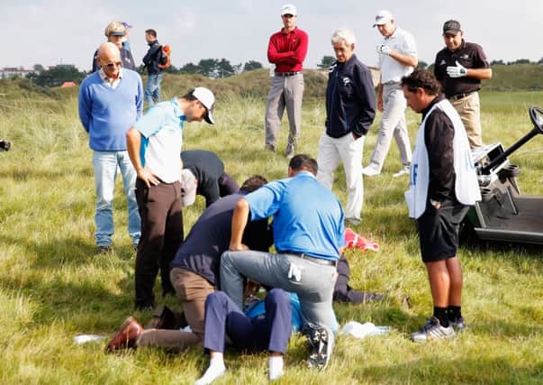 Fabrizio Zanotti of Paraguay is attended to by medical staff at the KLM Open yesterday. Picture: Getty