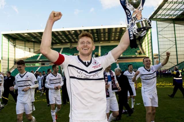 Raith Rovers captain Jason Thomson celebrates victory in last years Challenge Cup final. Picture: SNS
