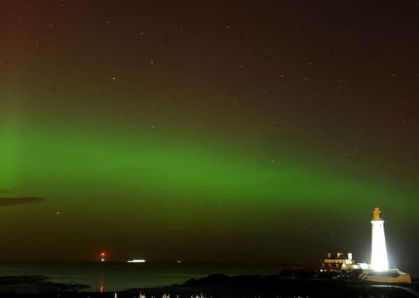 The aurora borealis pictured above Whitley Bay. The phenomenon will be seen in Scotland and northern England. Picture: PA