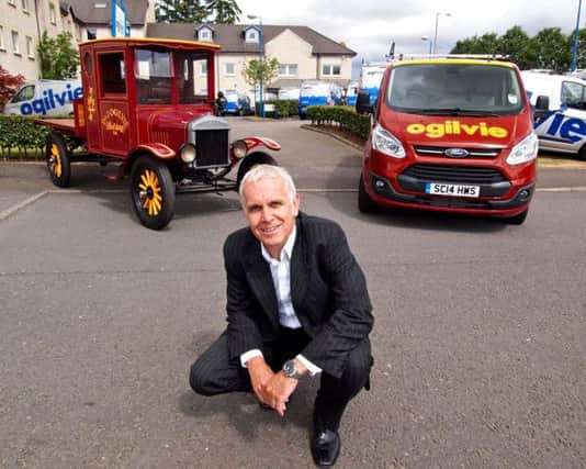 Duncan Ogilvie, with the vintage truck that was driven by his grandfather when he launched the business