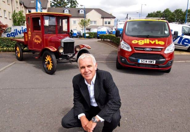 Duncan Ogilvie, with the vintage truck that was driven by his grandfather when he launched the business