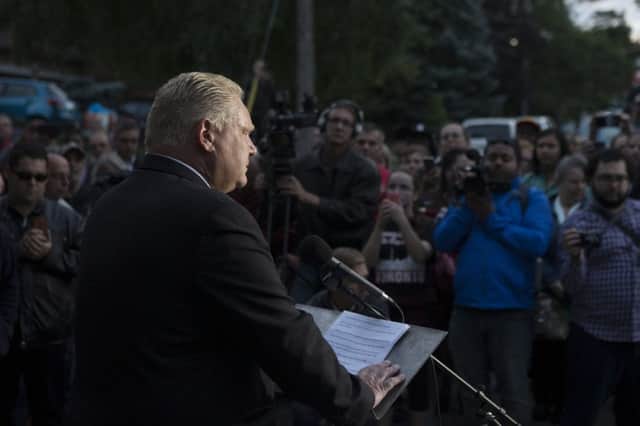 Doug Ford speaks outside his mothers home in Toronto. Picture: AP