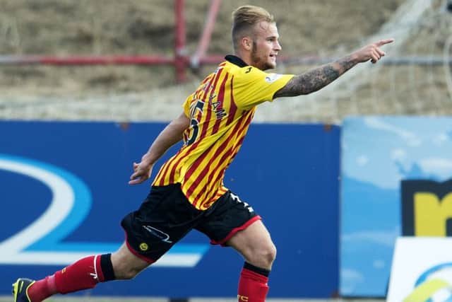 Partick's Kallum Higginbotham celebrates having put his side 3-1 up. Picture: SNS