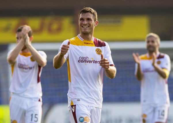 All smiles from Motherwell striker John Sutton at full-time. Picture: SNS