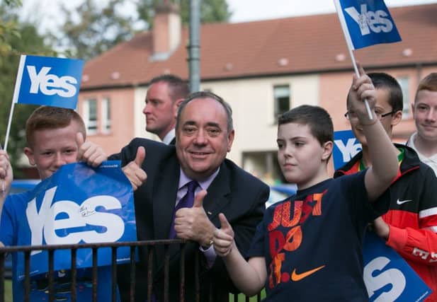 First Minister Alex Salmond gives the thumbs up to young supporters of the Yes campaign in Glasgow yesterday. Picture: Getty
