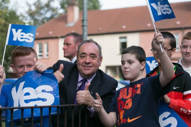 First Minister Alex Salmond gives the thumbs up to young supporters of the Yes campaign in Glasgow yesterday. Picture: Getty