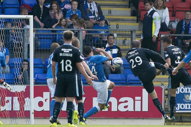 Gary Harkins and Thomas Konrad both try to smash home from close range. Picture: SNS