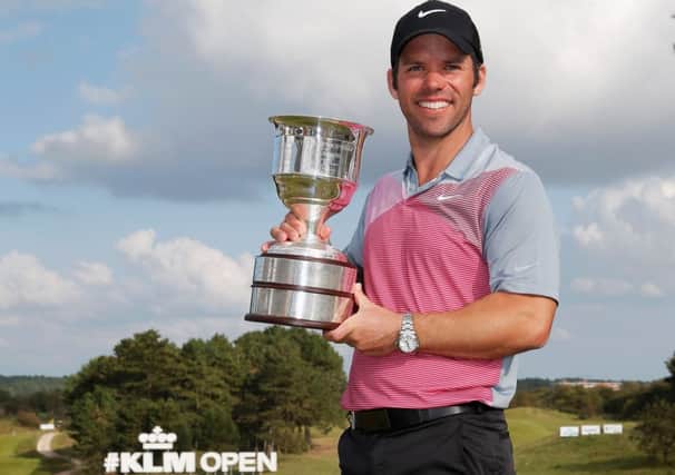 Paul Casey celebrates with the trophy after his success in the KLM Open yesterday. Picture: Getty