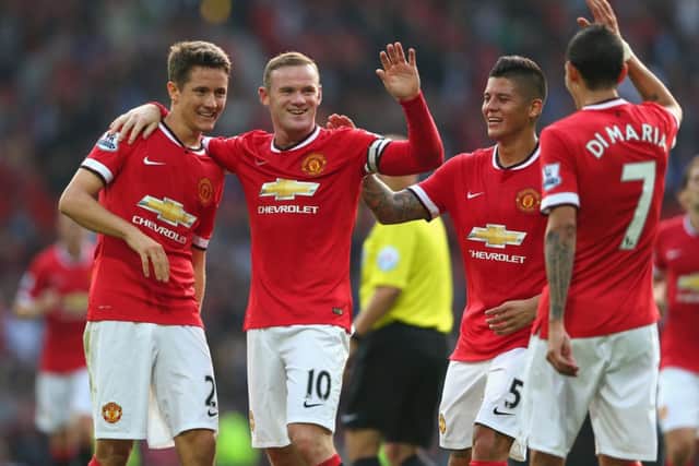 Wayne Rooney celebrates scoring Uniteds third goal with Ander Herrera, left, Marcos Rojo and Angel Di Maria. Picture: Getty