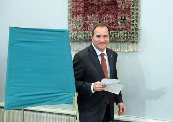 Swedish opposition leader Stefan Lofven of the Social Democratic party casts his vote. Picture: AFP