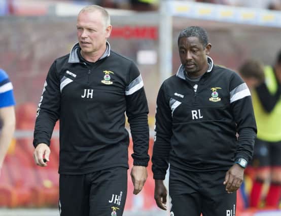 John Hughes and assistant Russell Latapy after the Firhill setback. Picture: SNS