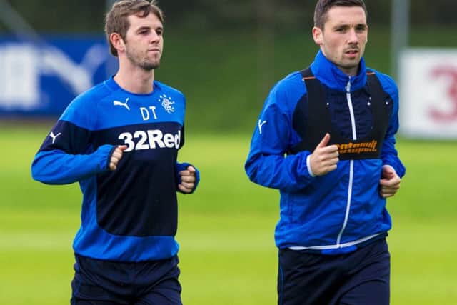 David Templeton, left, and Nicky Clark limber up in training in preparation for tonights League Cup clash. Picture: SNS