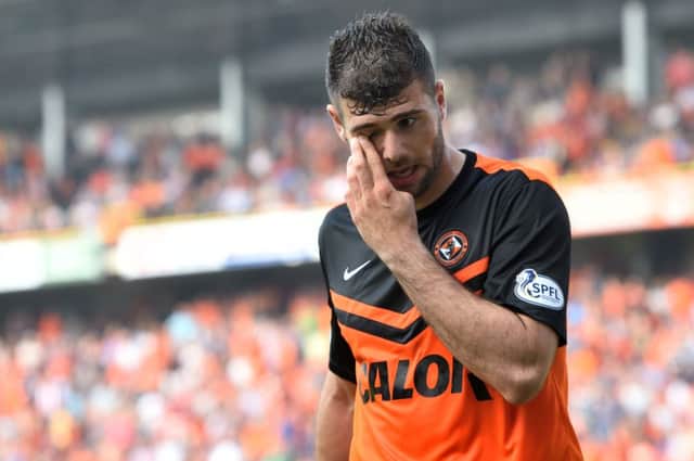 Nadir Ciftci is sent off after a second yellow for handling the ball. Picture: SNS