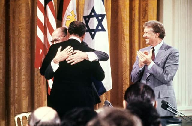 On this day in 1978, Egyptian president Anwar Sadat and Israeli premier Menachem Begin embrace after Camp David peace deal. Picture: Getty