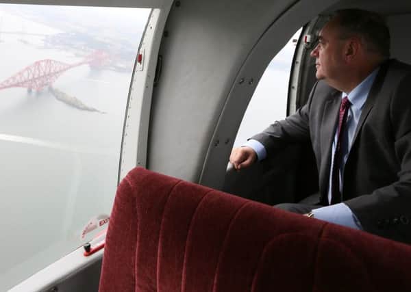 First Minister Alex Salmond looks down at the Forth Bridge near Edinburgh yesterday. Picture: Reuters