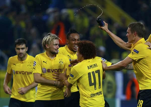 Borussia Dortmunds players celebrate at the final whistle after beating Arsenal. Picture: Reuters