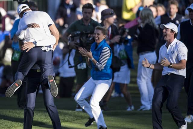 Martin Kaymer is embraced by Sergio Garcia after retaining the Ryder Cup at Medinah. Picture: AFP