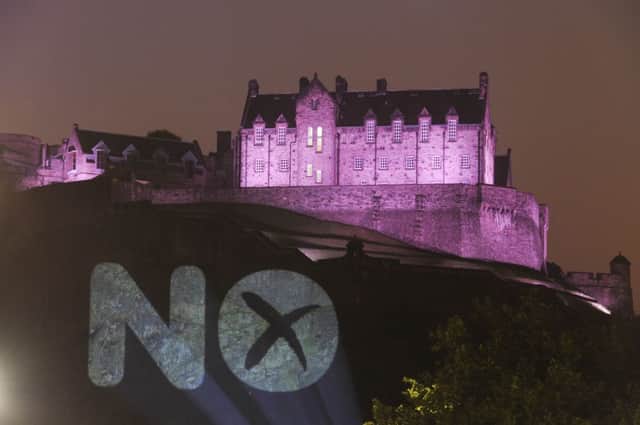 A giant No sign is projected on to Edinburgh Castle. Picture: Greg Macvean