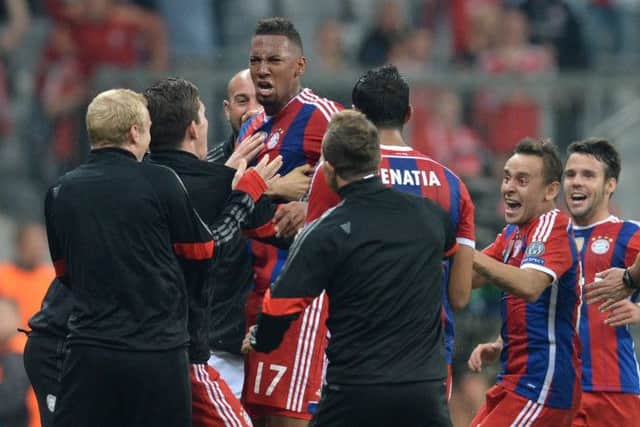 Jerome Boateng and his teammates celebrate his 89thminute winner. Picture: Christof Stache/AFP/Getty