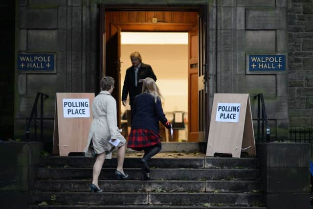 A young voter arrives at a polling station to cast her vote in Edinburgh, Scotland. Picture: Getty