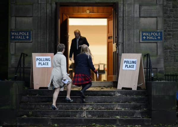 A young voter arrives at a polling station to cast her vote in Edinburgh, Scotland. Picture: Getty