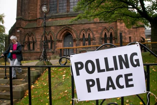 Voters leave a polling place in Edinburgh. Picture: Getty