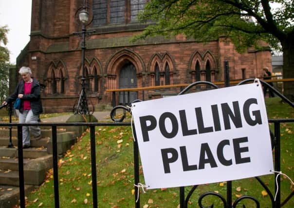 Voters leave a polling place in Edinburgh. Picture: Getty