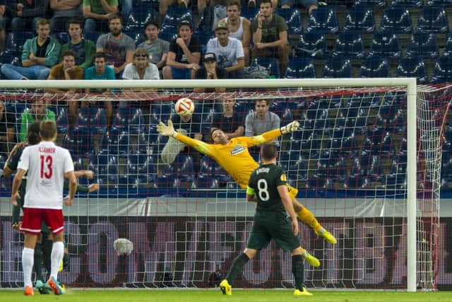 Craig Gordon (centre) makes a finger tip save at 1-0 to keep Celtic ahead. Picture: SNS