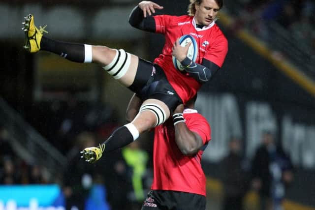 Tendai Beast Mtawarira holds up Anton Bresler during the 2012 Super Rugby final. Picture: Getty