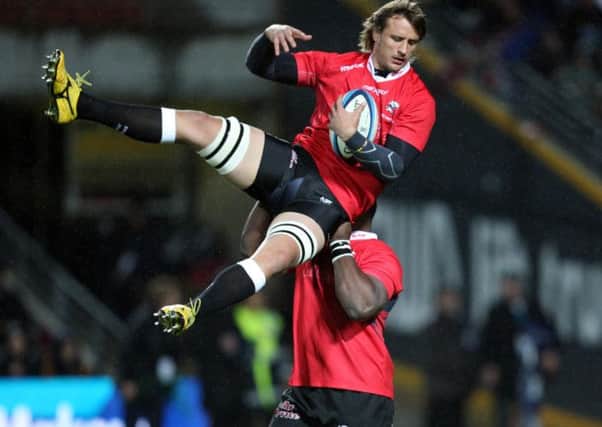 Tendai Beast Mtawarira holds up Anton Bresler during the 2012 Super Rugby final. Picture: Getty