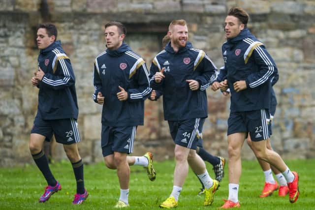 Adam Eckersley, centre, has been thrown in at the deep end at Hearts. Picture: SNS
