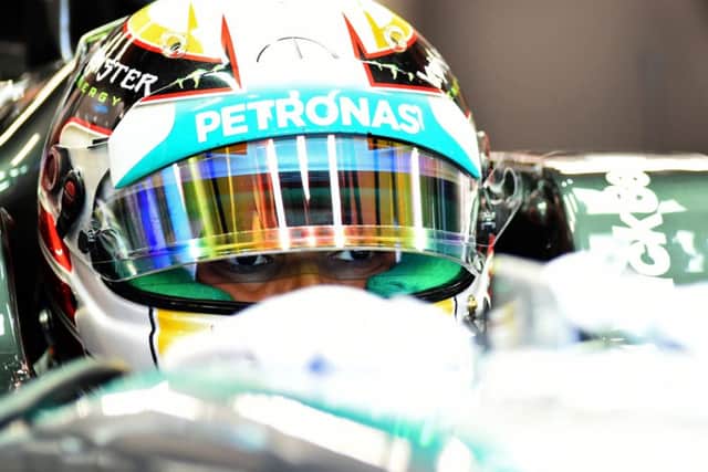 Lewis Hamilton in his Mercedes in the pits at Singapore GP practice yesterday. Picture: Getty