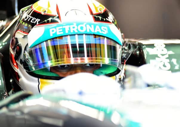 Lewis Hamilton in his Mercedes in the pits at Singapore GP practice yesterday. Picture: Getty