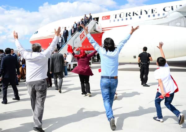 Relatives of the freed hostages run to greet their loved ones. Picture: Getty Images