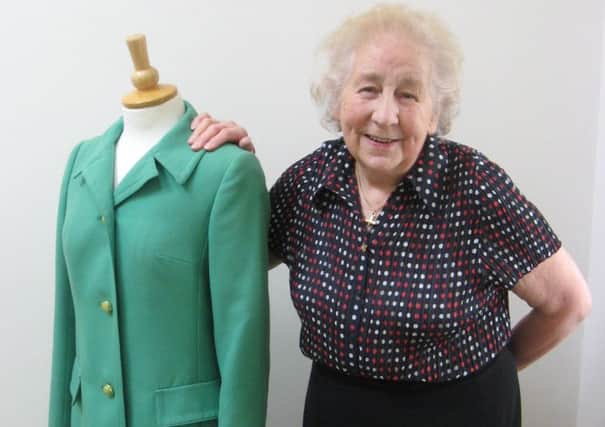 Coltman with her first Aquascutum coat and in her BEA uniform. Picture: Contributed