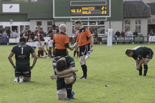 Hawick players are disconsolate following Galas winning drop goal. Picture: Toby Williams